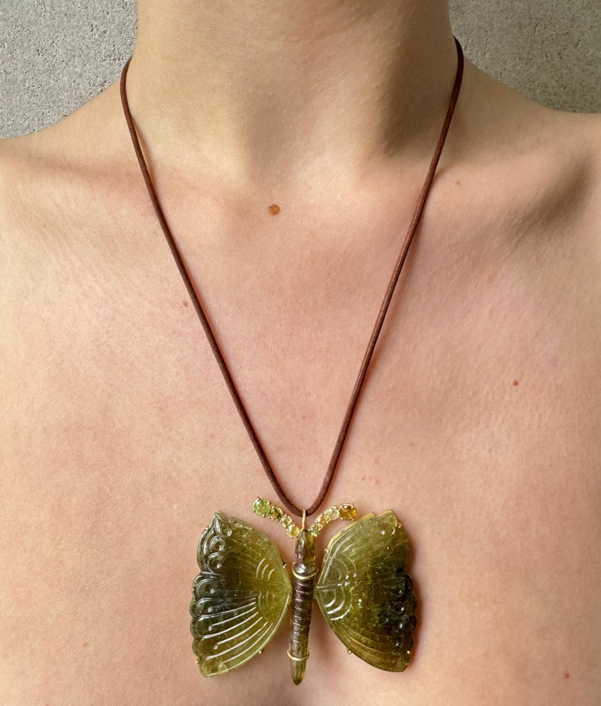 Bi Color Butterfly Carving Pendant with Sphene Antennae on Brown Cord