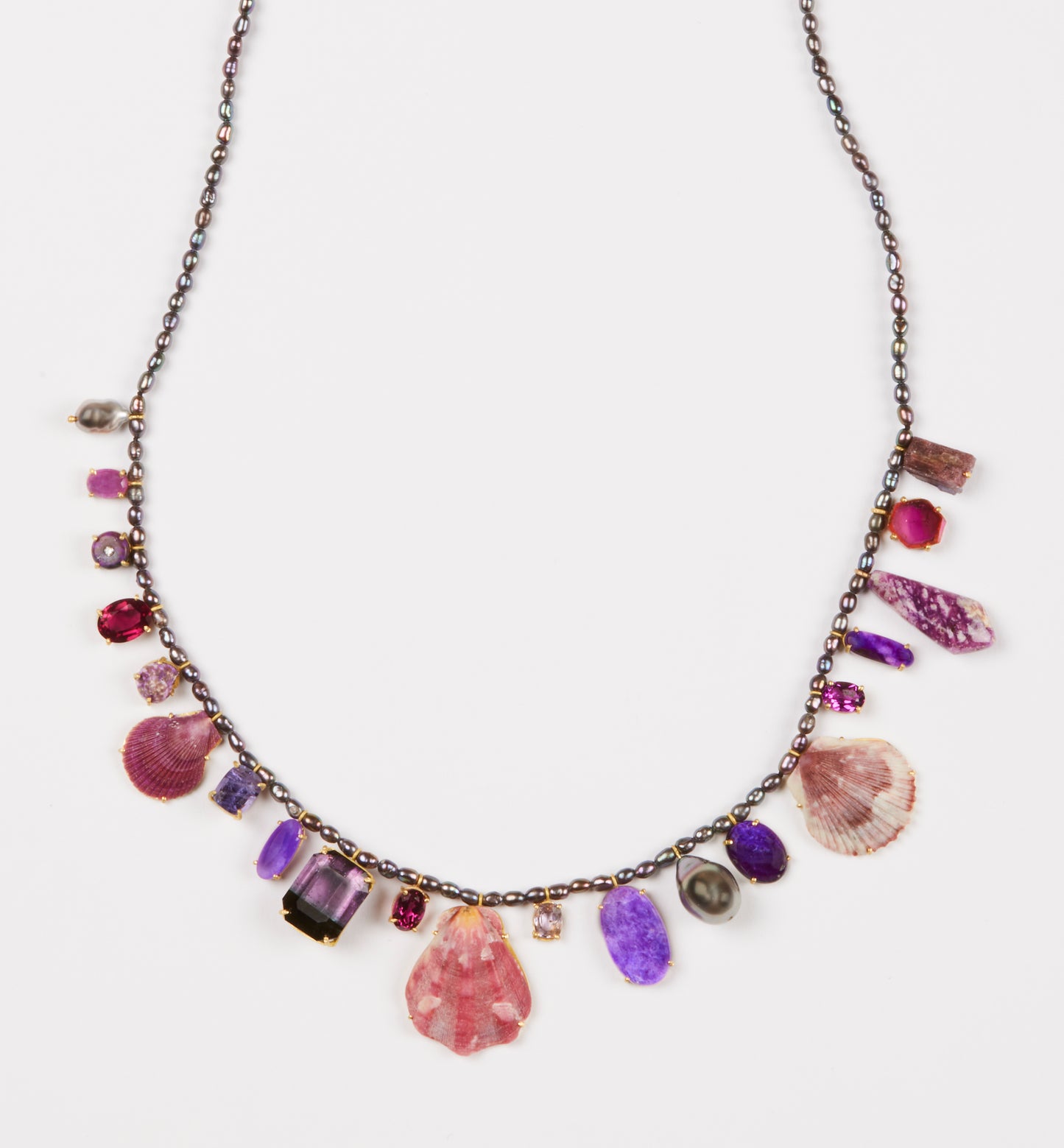 Pearls, Garnet, Spinel, Tourmaline, Sujilite, Shells and Diamond