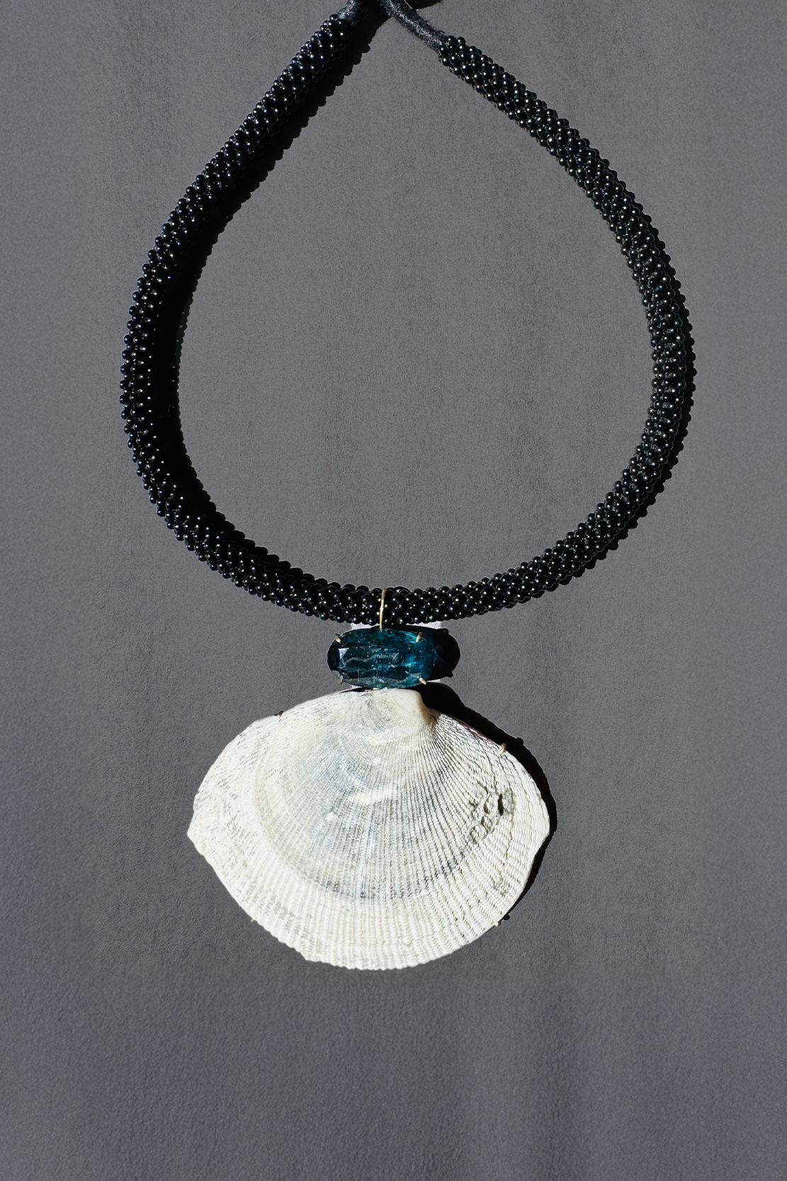Black Onyx Embroidered Cord with Kyanite and Shell.