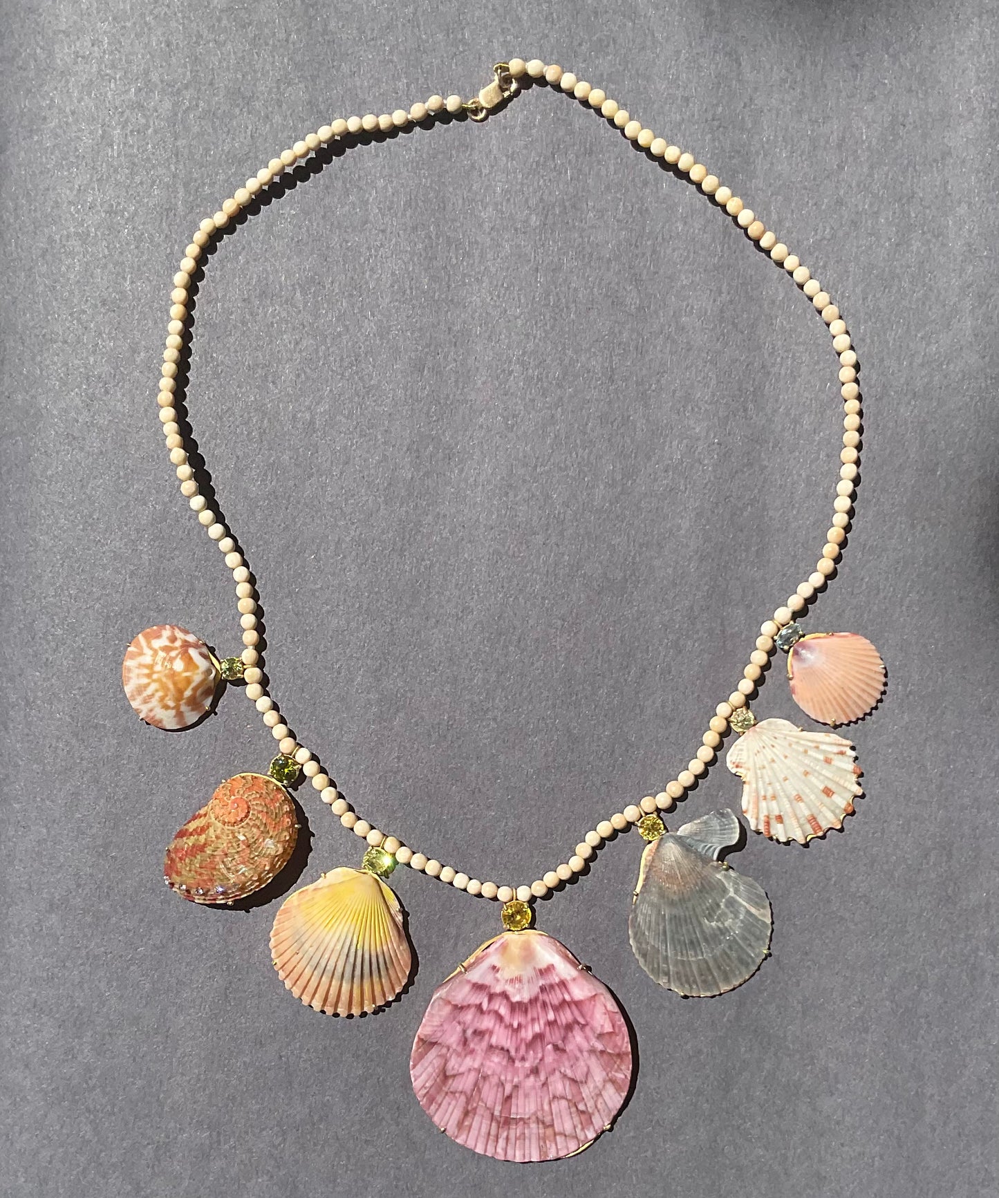 Wooly Mammoth Beads with Shells, Sphene, Aquamarine and Diamonds.