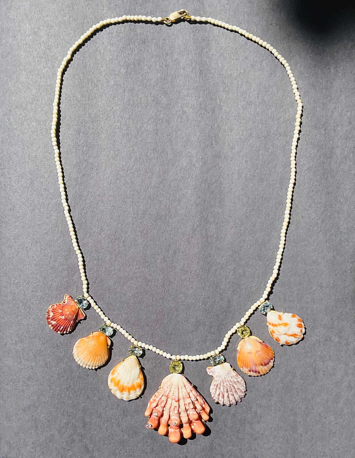 Wooly Mammoth Beads with Orange shells, Sphene, Aquamarine and Diamonds.