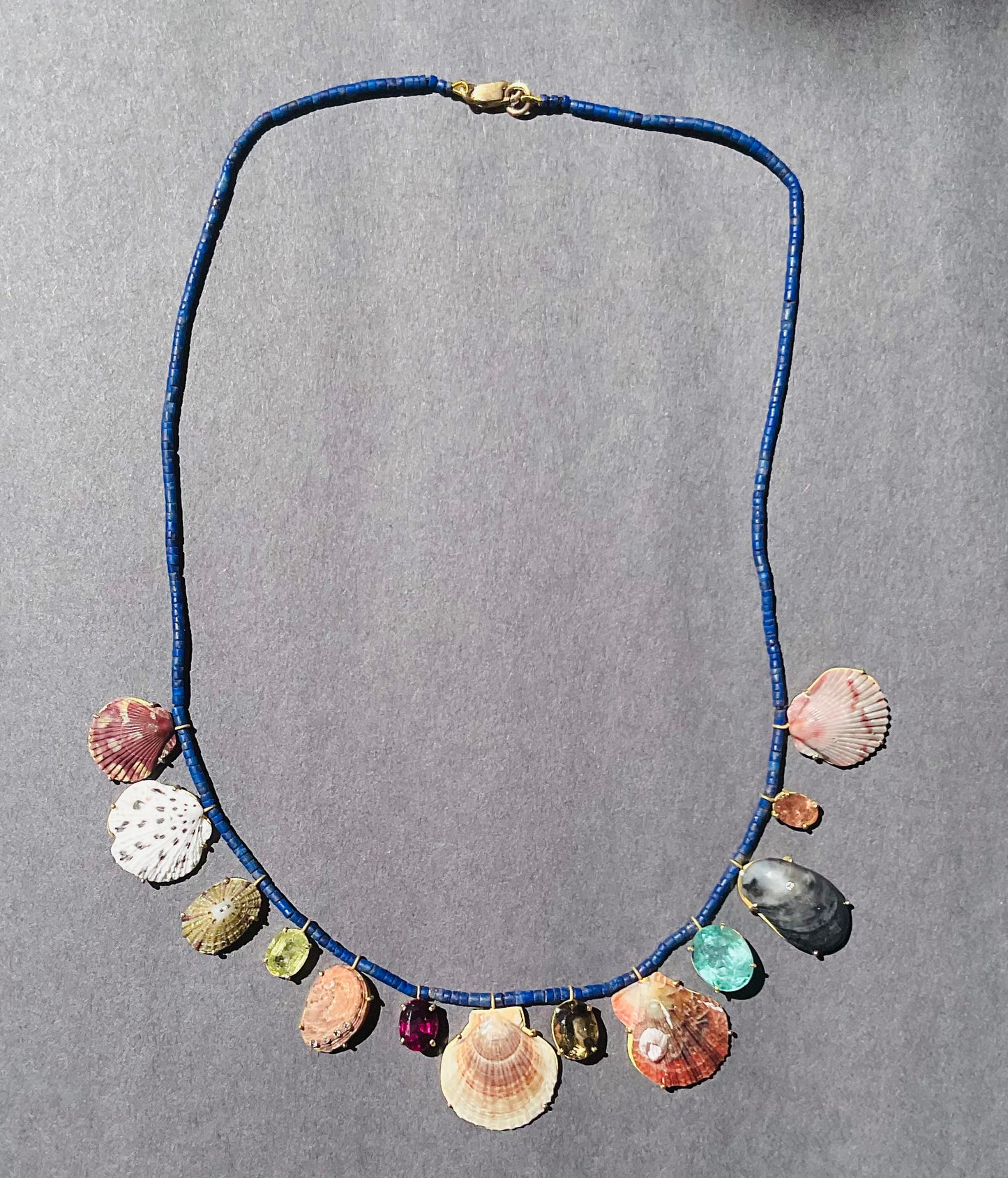 Lapis Beads with Sphene, Garnet, Smokey Topaz, Tourmaline, Diamonds and Shells.