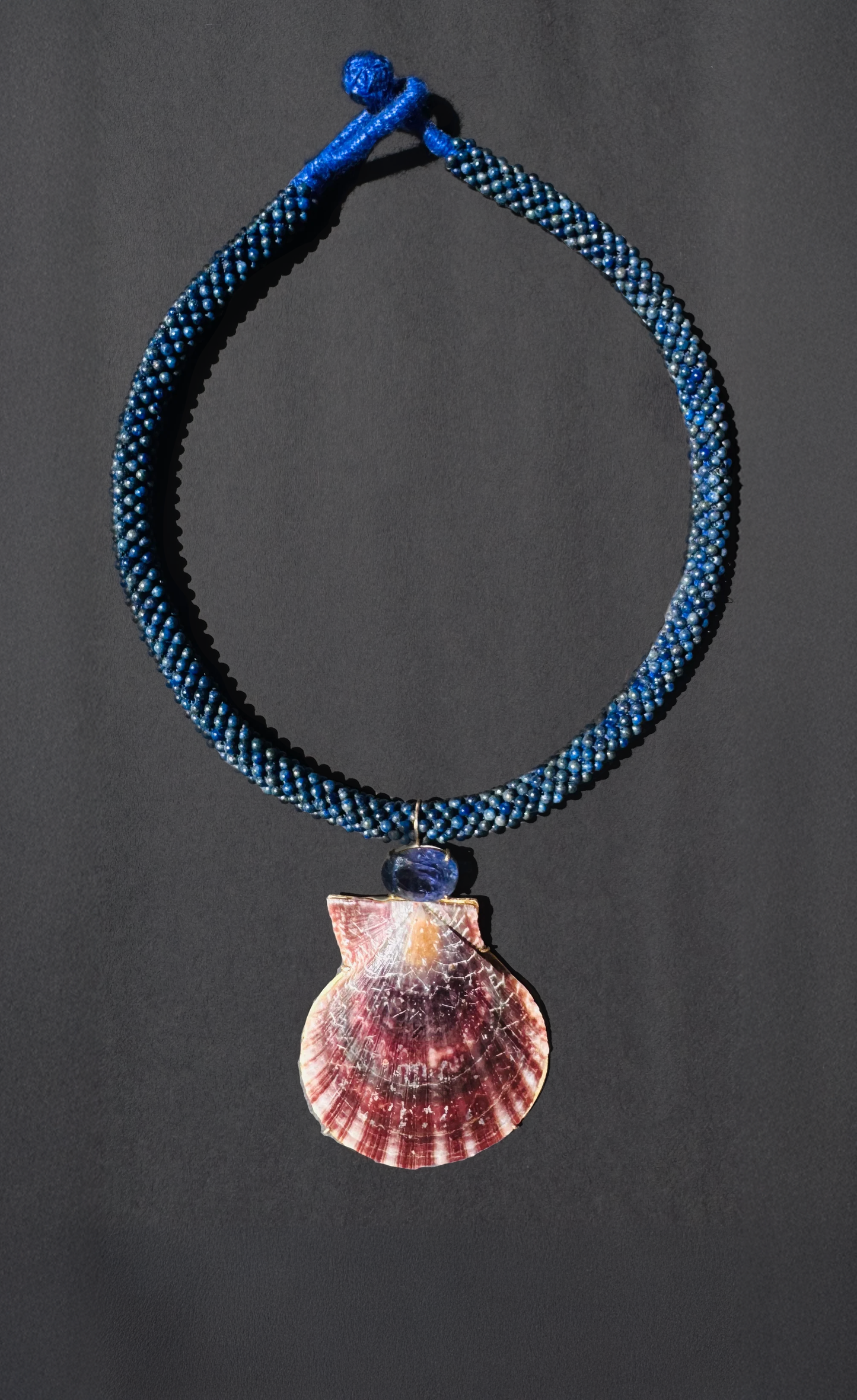 Lapis embroidered cord with Tanzanite and shell.