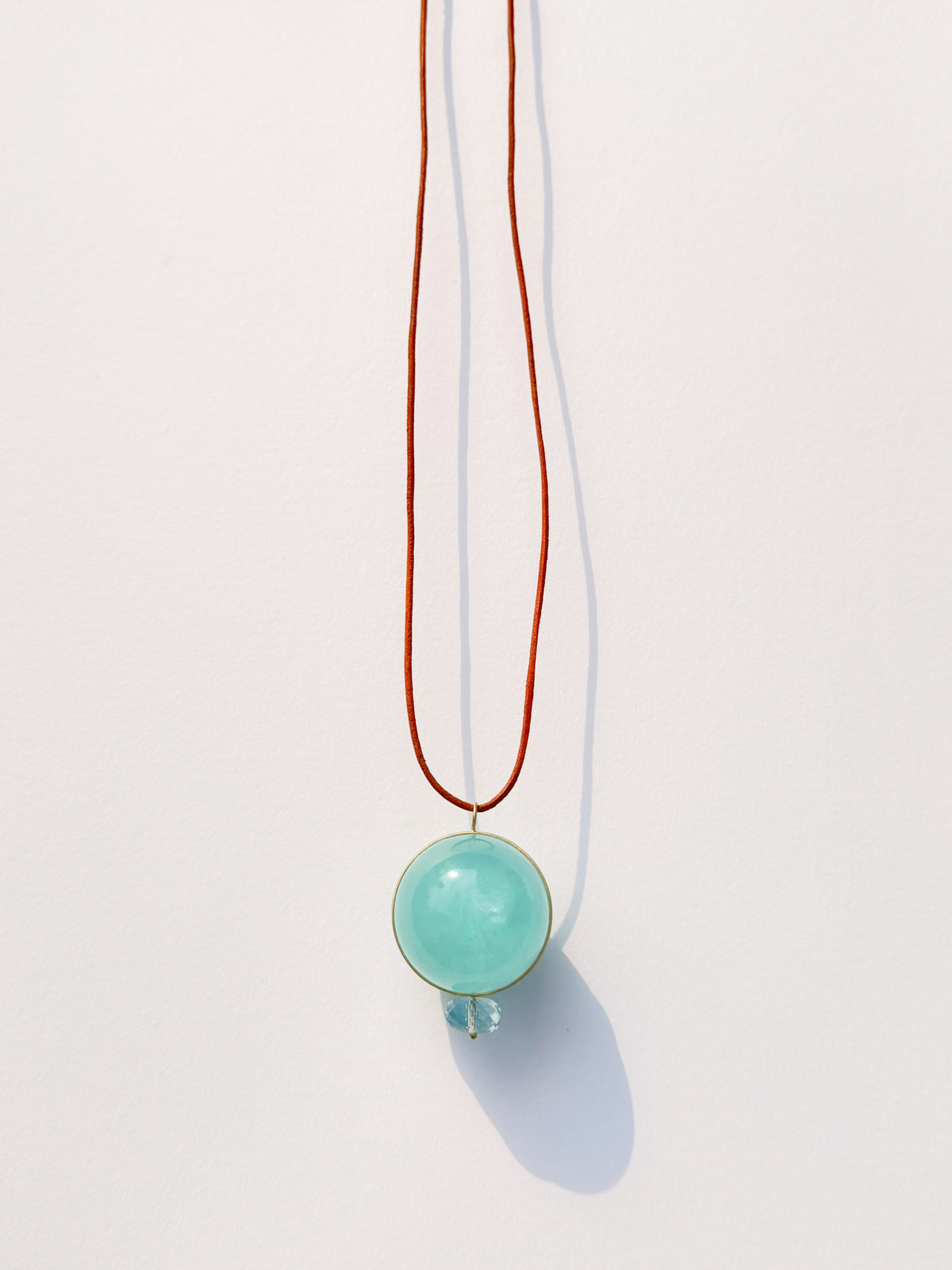 Aquamarine Healing Sphere with Faceted Aquamarine.