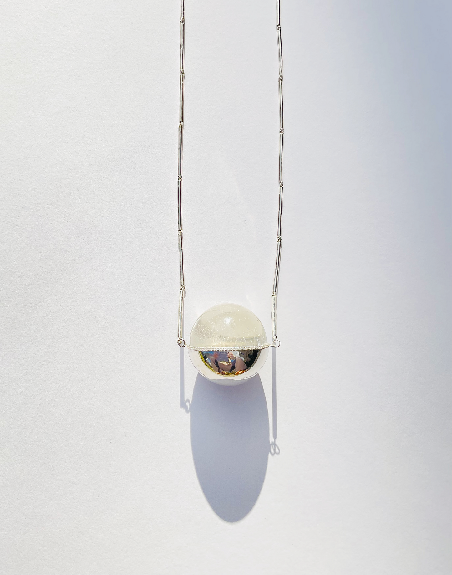 Quartz Healing Sphere set in Silver with Diamonds on a Bar Chain