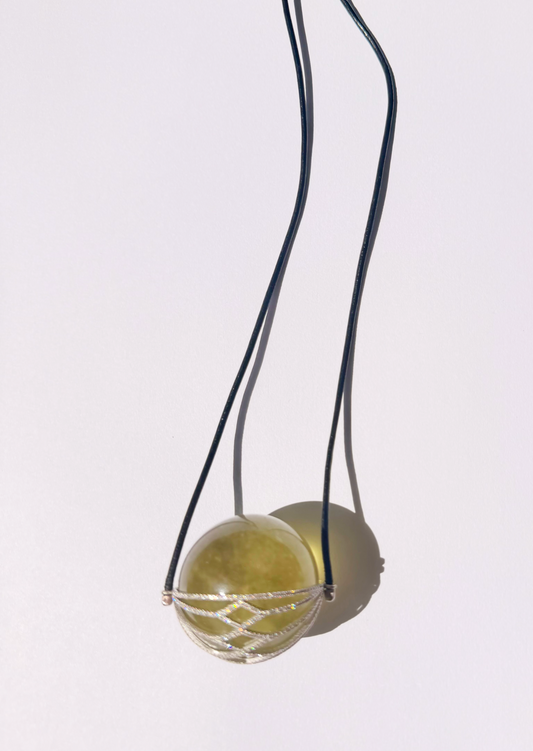 Libyan Desert Glass Healing Sphere in Diamond Basket