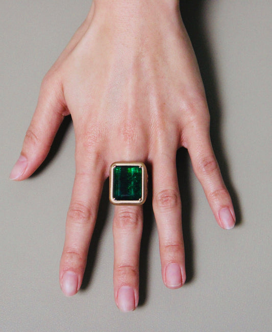 Green Tourmaline Cigar Band with Diamond Detail on the sides.