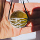 Libyan Desert Glass Healing Sphere in Diamond Basket